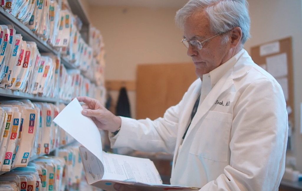 Dr. Boak reviewing patient charts