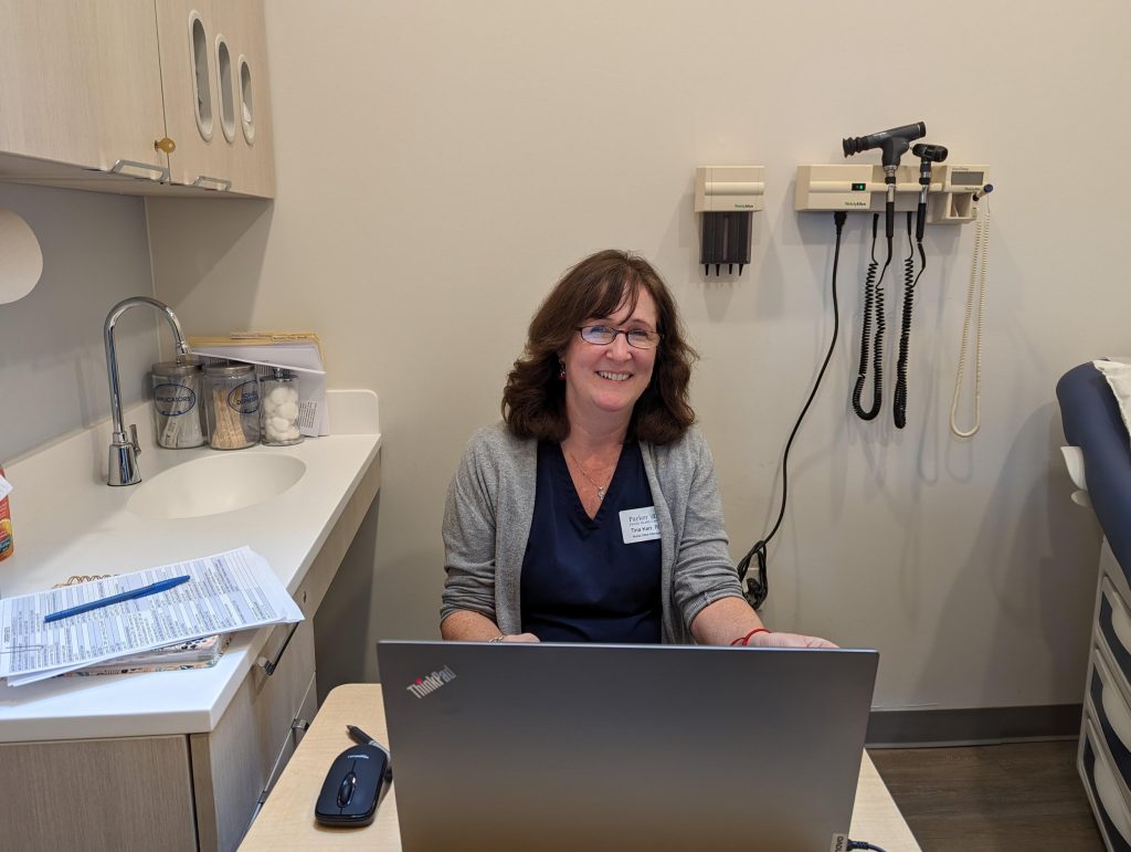 Tina at work in one of the clinic's new exam rooms