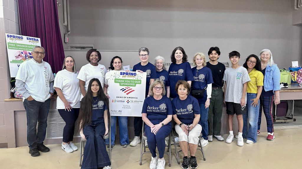Volunteers and community partners at a spring community event
