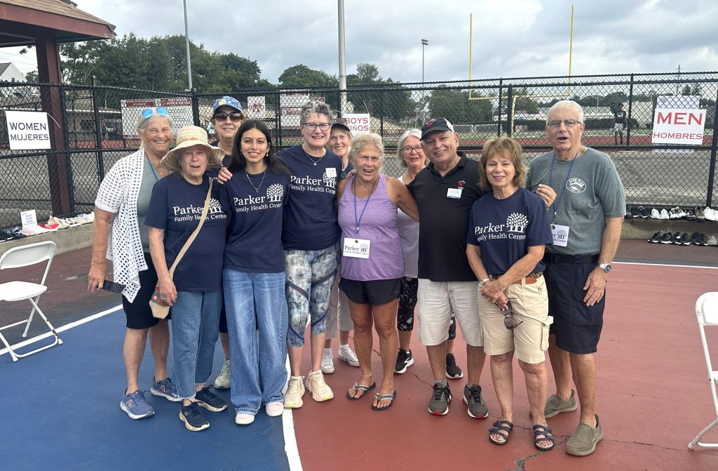 Parker volunteers in navy Parker T-shirts at an outdoor community event